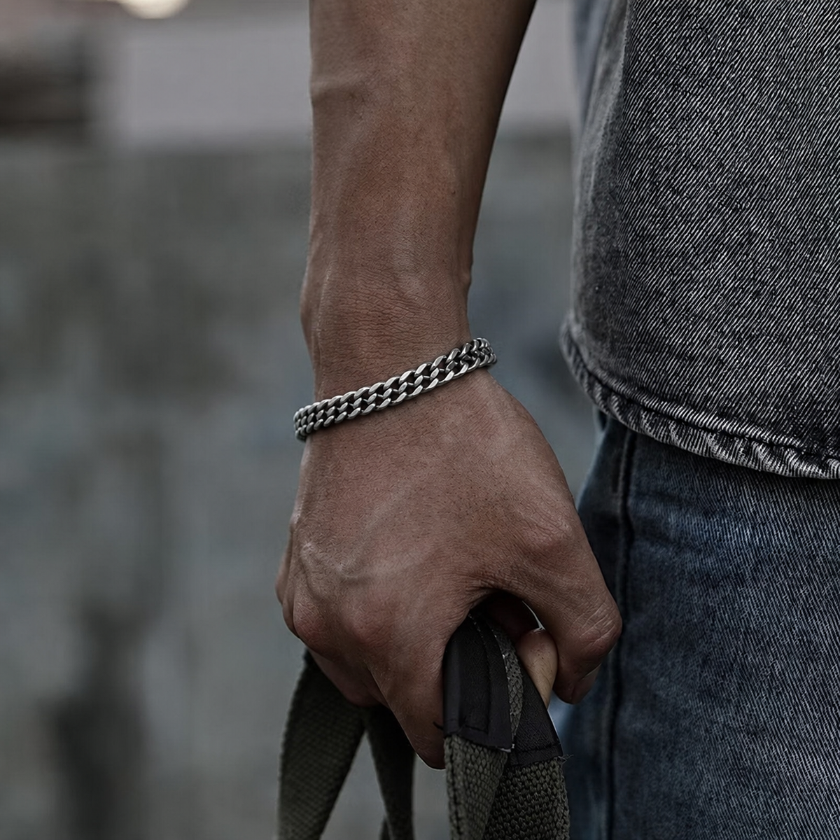 Silver curb chain bracelet on wrist