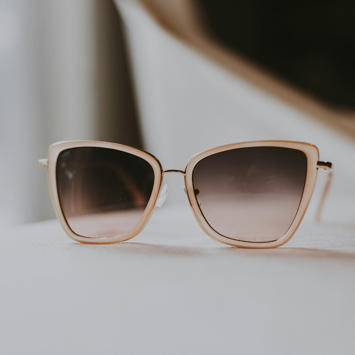 Sunglasses on stone surface