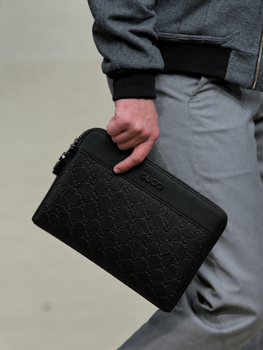 Gucci Men's Black GG Embossed Leather Clutch Bag