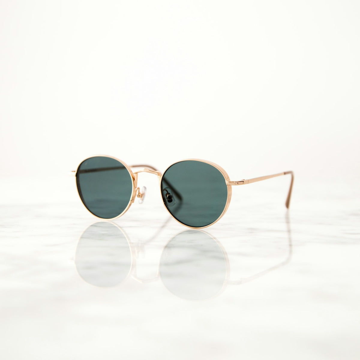 Sunglasses held toward the light